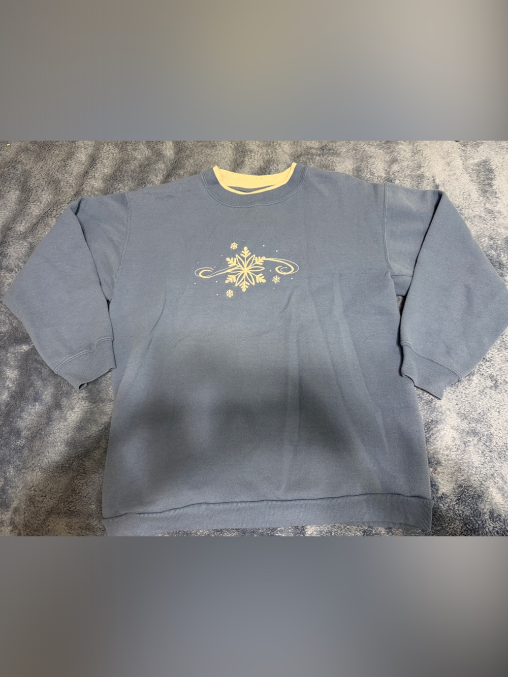Blue Sweater with Yellow Snowflake Design